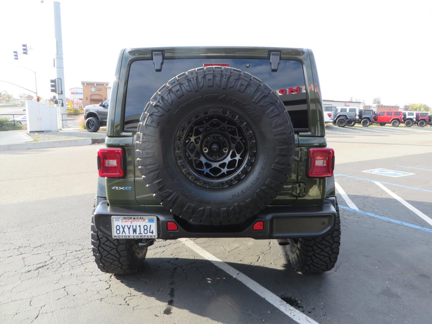 2021 Sarge Green /BLACK Jeep Wrangler Unlimited Sahara 4XE 4d SUV 4wd (1C4JJXP6XMW) with an 2.0L I4 DOHC DI Turbo PHEV engine, 8-speed Automatic transmission, located at 2630 Grass Valley Highway, Auburn, CA, 95603, (530) 508-5100, 38.937893, -121.095482 - 4XE Sahara with a Teraflex suspension system, Falcon shocks, 17" Fuel Offroad wheels, and 37" Nitto Ridge Grappler tires. - Photo#5